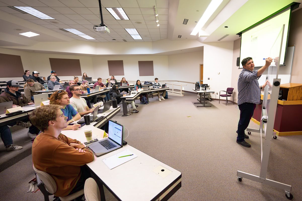 A UM professor teaches his data analytics class in the Gallagher Business Building at the University of Montana