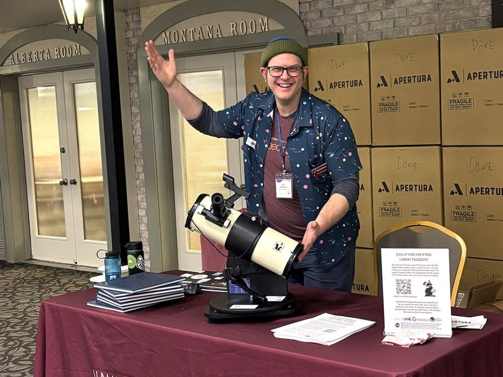 Astronomer Nick Wethington posing with telescope
