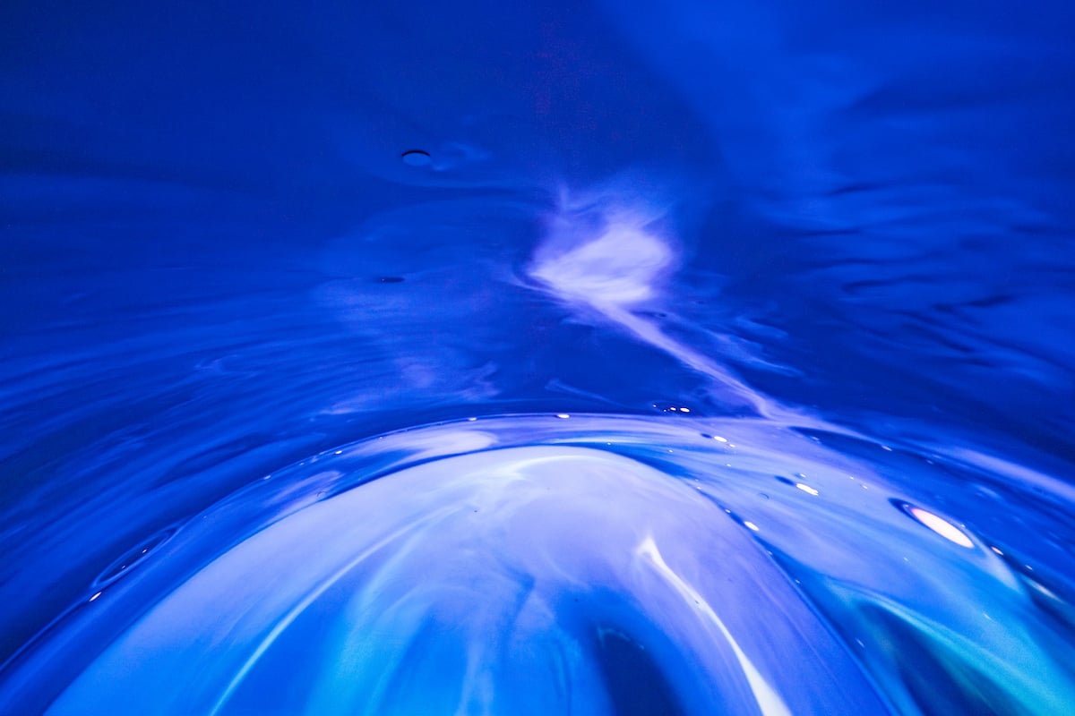 Blue and white swirls that look like deep water from a scene from the “Sounds of the Ocean” planetarium show at the University of Montana.