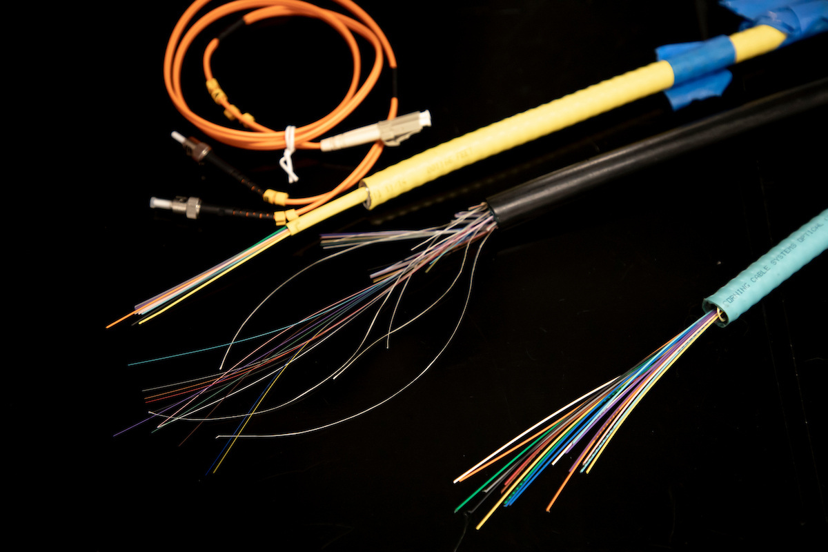 Sliced open cables showing many wires of different colors and sizes.